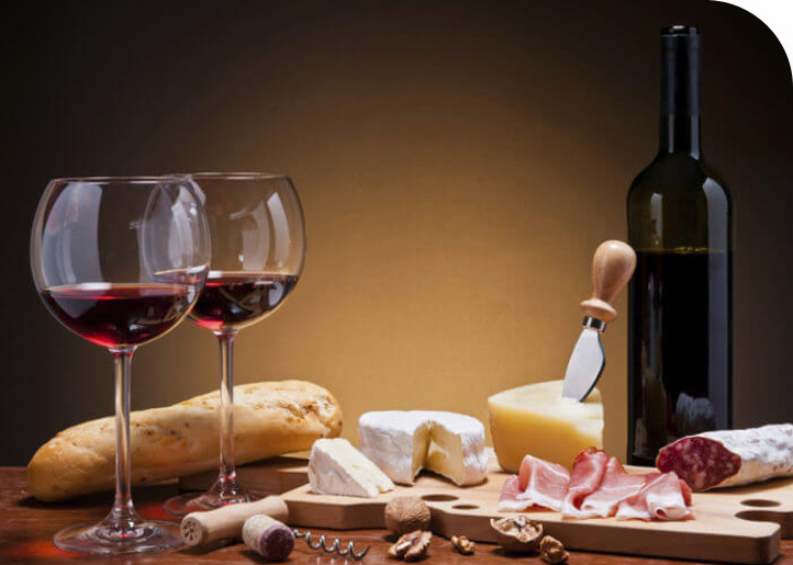 Wine and cheese on table